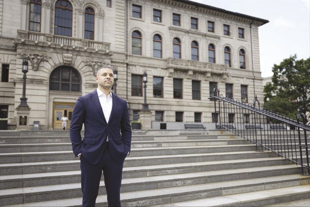 Seth Pitts looking into the distance behind Worcester City Hall