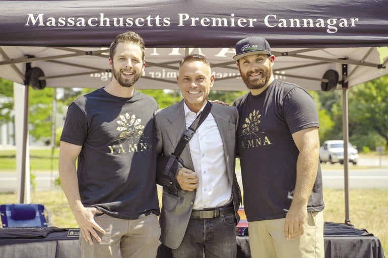 A photo of Kevin MacConnell and Tim Phillips with entrepreneur and former 