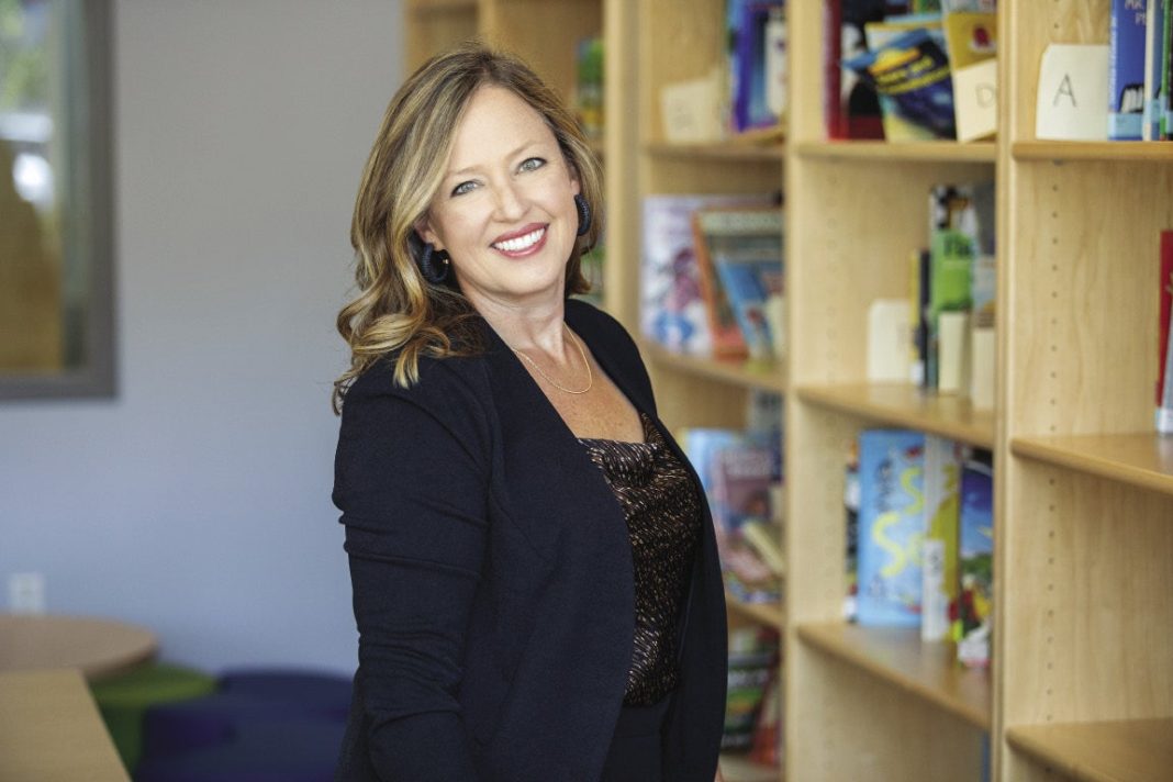 A woman in a black pants suit
