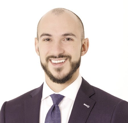 Nicholas J. Colantuono in a suit smiling