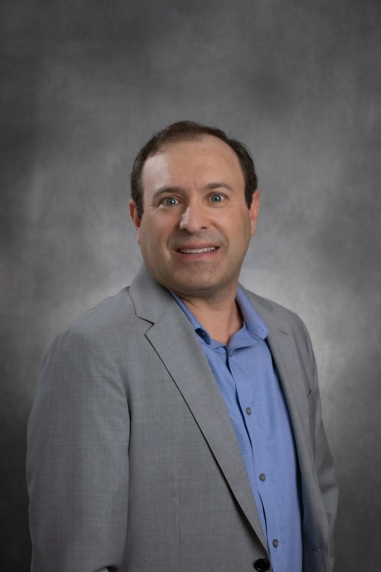 A portrait of AiM Medical Robotics CEO Gregory Fischer