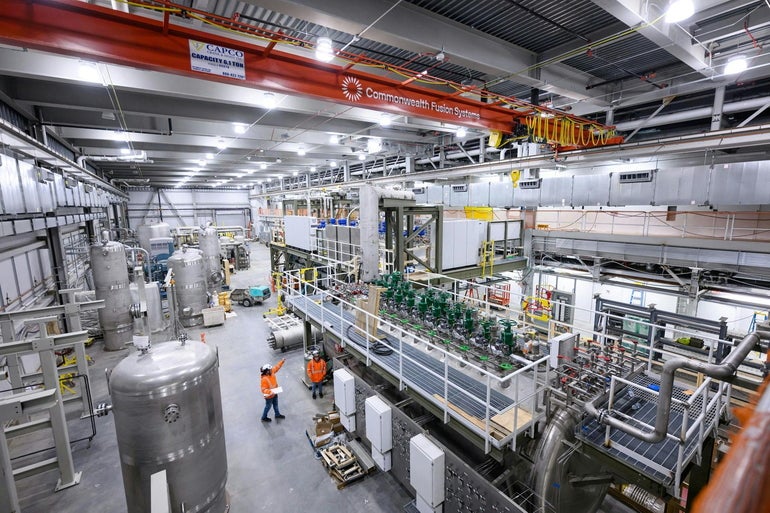Interior of a large industrial building with lots of machinery