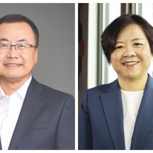 Side-by-side headshots of a man on the left and a woman on the right. Both wear blue suit jackets and white tops.