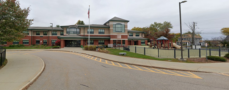 A view of Henry P. Clough middle school and its adjoining playground in Mendon from the parking loop.