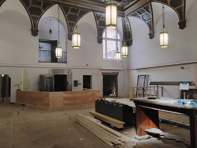 The interior of an old bank building under renovation
