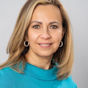 a woman with teal shirt