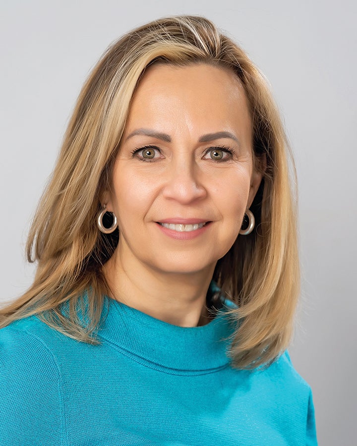 a woman with teal shirt