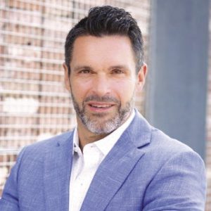 Man in blue suit and white dress shirt
