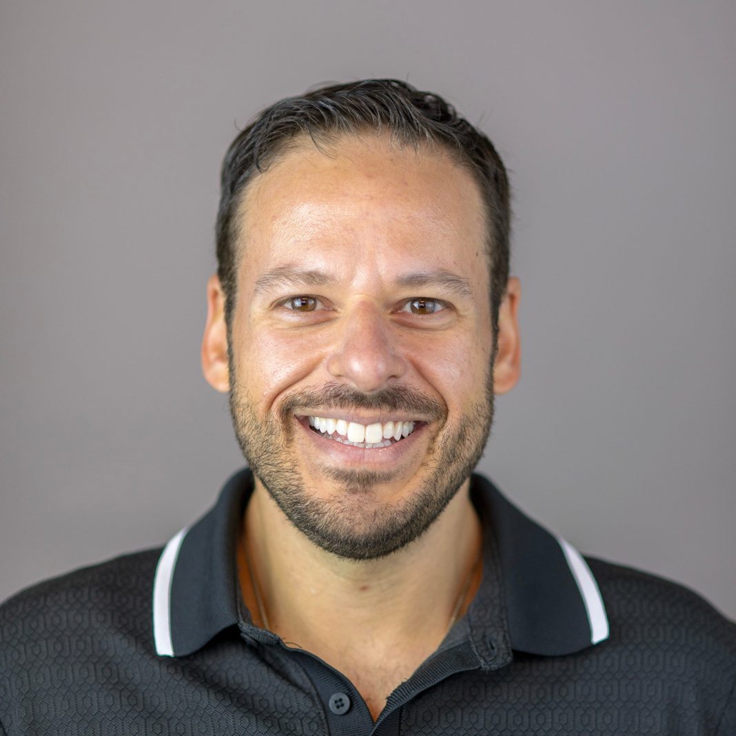 Man in black polo
