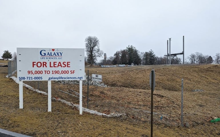 For lease sign in front of a mostly empty parcel