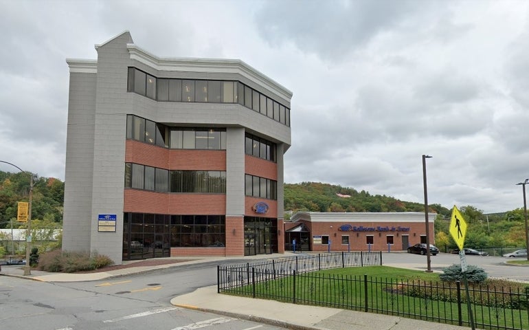 A skinny four-story office building