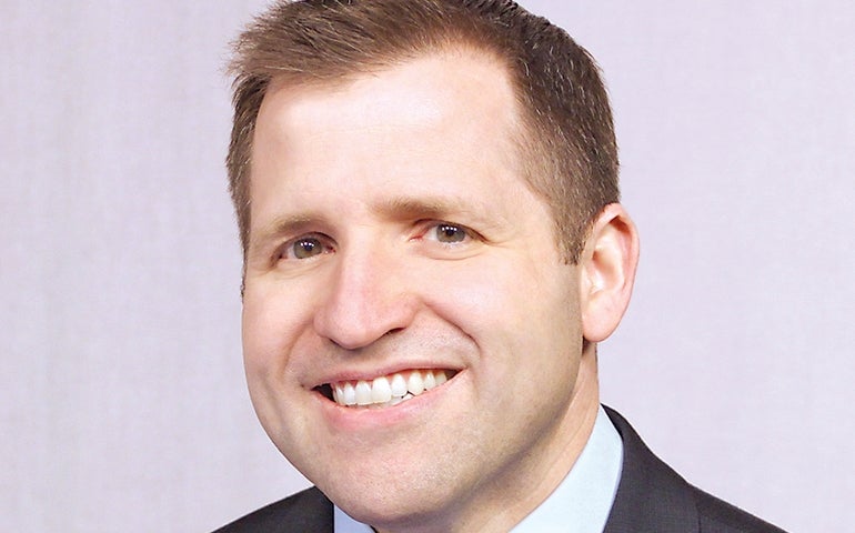 smiling man in suit