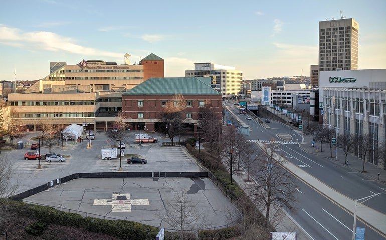 A large hospital building in an urban setting
