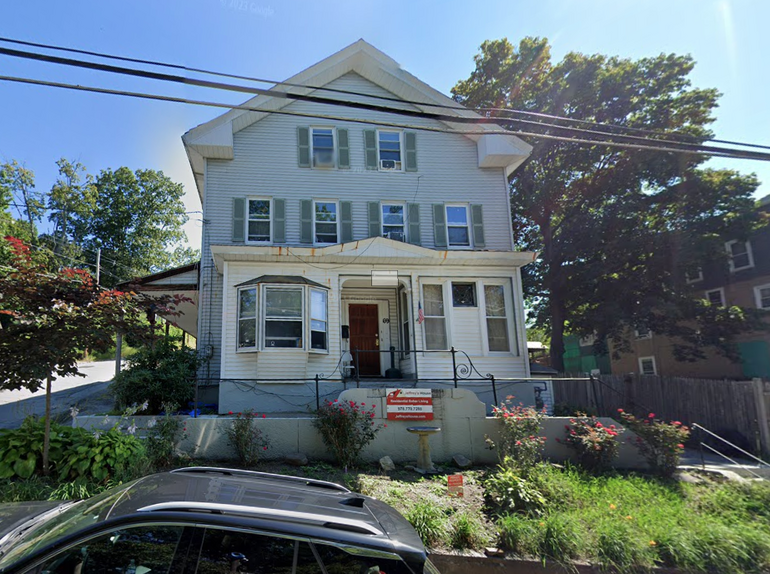 A white three-story house