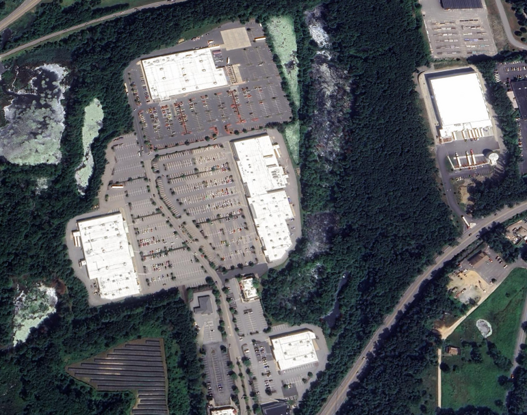 A satellite image of a shopping plaza