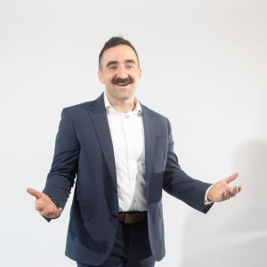 A man with a mustache in a suit