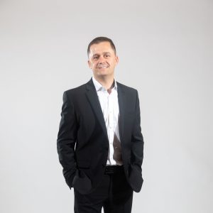 A man in a black suit
