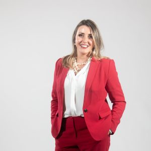 A woman in a red suit
