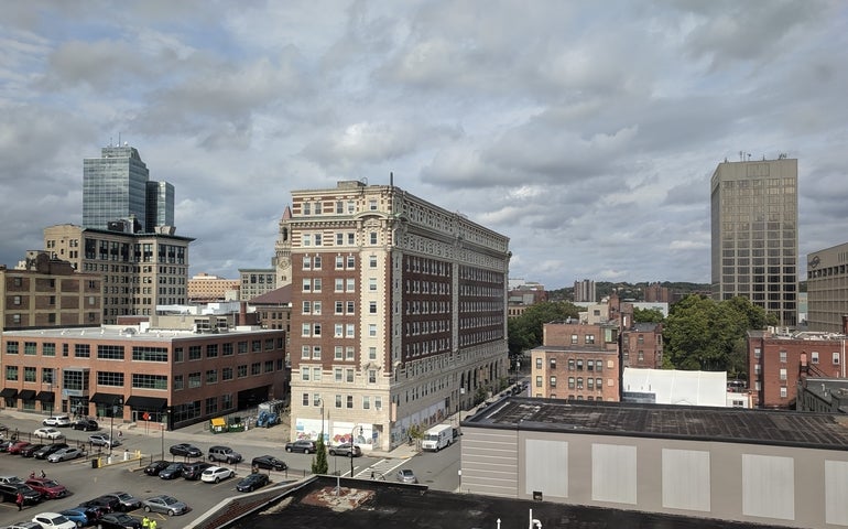 The Worcester skyline with buildings against a cloudy sky