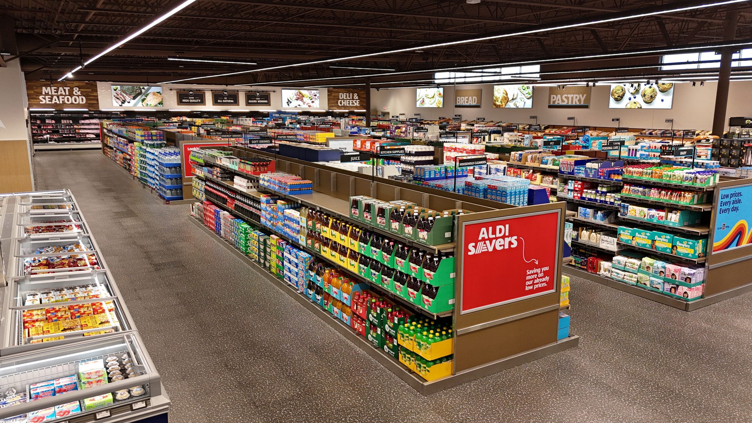 The interior of a grocery store from a high enough vantage point that the whole store can be seen.