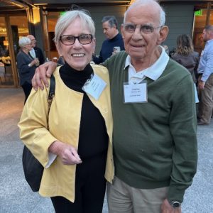 A woman and a man pose for a photo