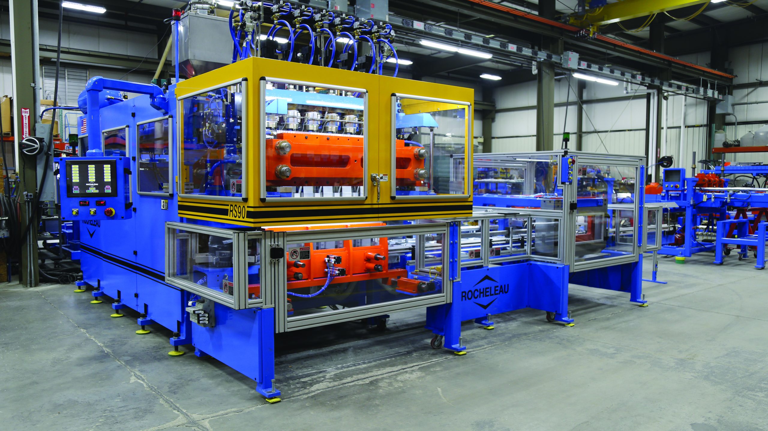 A large machine sits on a factory floor