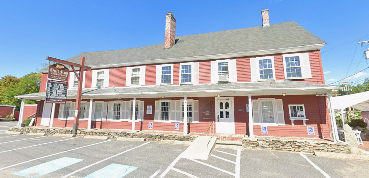 Two-story red inn building