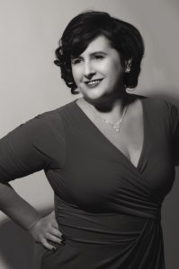 A black and white photo of a woman with bob