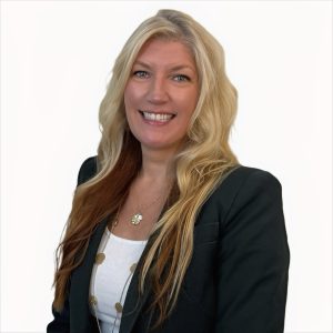 Woman in black suit smiles