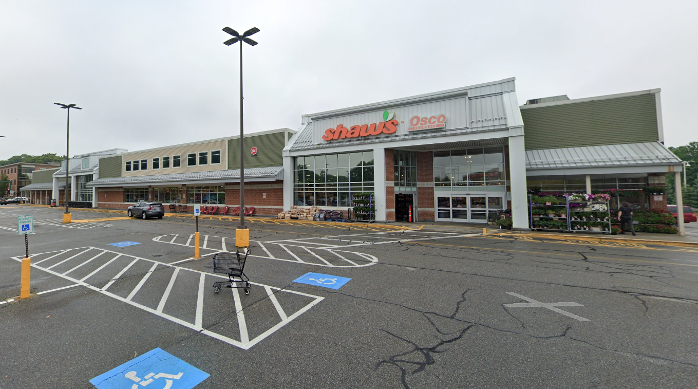 Exterior of a one-story grocery store from the parking lot
