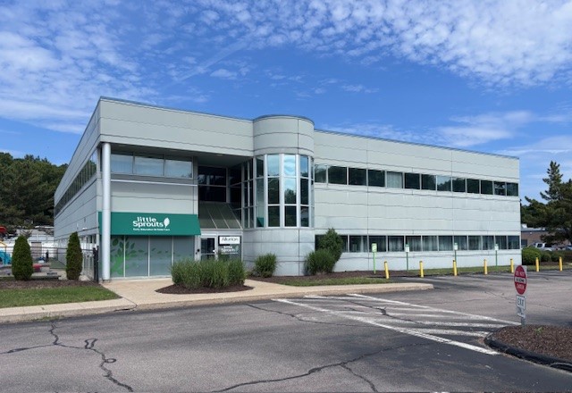 A two-story gray office building
